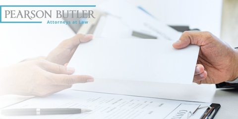 Two hands holding a piece of paper